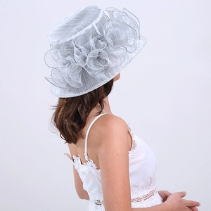 Detail of light gray organza sun hat with layered ruffle flower for elegant styling