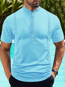 Detail of cyan textured knit polo shirt featuring a mandarin collar and vertical stripe pattern