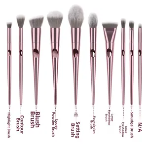 Detail of 10-piece makeup brush set with rose gold metal handles and soft grey bristles
