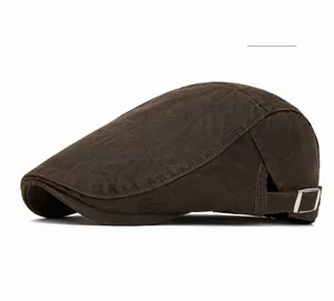 Detail view of coffee brown cotton flat cap with adjustable side buckle and stitching