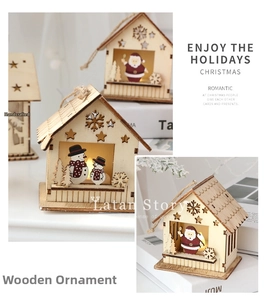 Detail of laser-cut wooden Christmas cabin with warm LED glow and snowman pattern