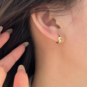 Minimalist 925 sterling silver gold hoop earrings shown on model for elegant style