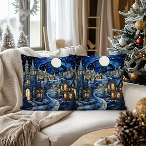Detailed view of blue Christmas pillowcases with golden castle prints on a cozy sofa setting