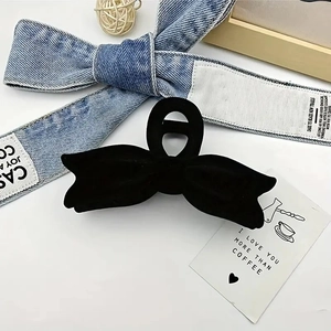 Elegant black velvet bow hair claw clip with flocking texture for women's hairstyles