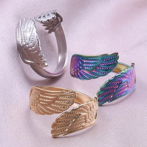 Adjustable stainless steel angel wing rings in gold, silver, and iridescent colors