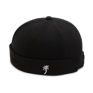 Black cotton Miki Hat with white coconut tree embroidery on a clean white background