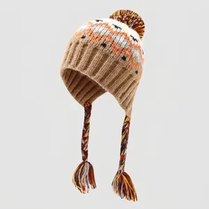Detailed knit texture of warm winter kids earflap hat with colorful geometric pattern