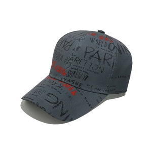 Detailed close-up of graffiti letter print on dark grey-blue cotton baseball cap fabric