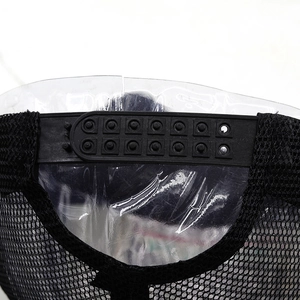 Close-up of black snapback closure and breathable mesh on western embroidered cap