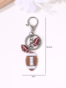 Detail view of American football keychain with 10.4cm length and 3cm pendant size