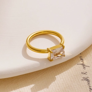 Macro shot of 18K gold plated ring featuring a large rectangular cubic zirconia in 4-prong setting