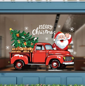 Detail of red Christmas truck window sticker with Santa Claus and festive snowflakes