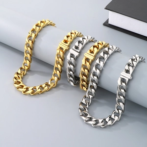 Men's 13mm stainless steel Cuban link bracelets in gold and silver finish on display
