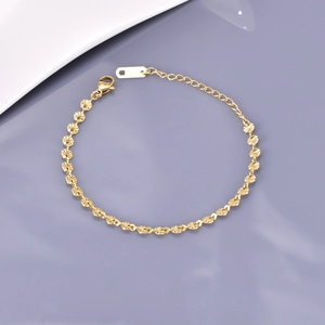 Elegant 18K gold snowflake link bracelet with sunburst discs and lobster clasp