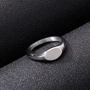 Detail of silver signet ring with vintage textured finish and horizontal grooved design