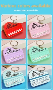 Detail view of colorful mini piano keychains in six vibrant shades with music patterns