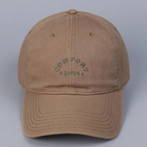 Detail of khaki cotton baseball cap with green COMFORT ZONES letter embroidery