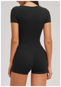 Detail of black high-waist fitness shorts with V-shaped back stitching for butt-lifting effect
