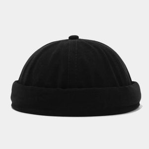 Detailed view of the pure black docker hat showing minimalist brimless cuff and cotton texture
