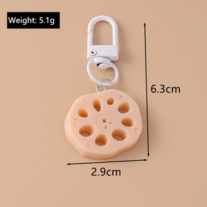Macro detail of lotus root food keychain showing 5.1g weight and dimensions