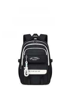 Detail view of black minimalist backpack with multi-layered pockets and star accessory