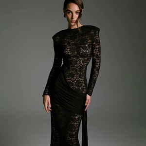 Detail of elegant black lace textures and draped fabric on a slim-fit evening dress
