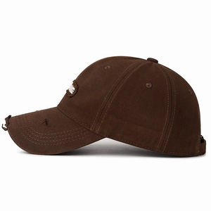 Washed cotton baseball cap in dark brown featuring distressed details and MADE patch