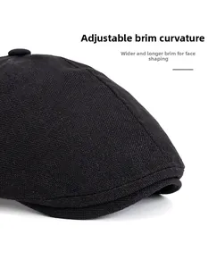 Close-up of a black ivy cap showing the textured knit fabric and wide foldable brim