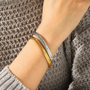 Elegant striped stainless steel bracelet with rhinestones in gold and silver finish