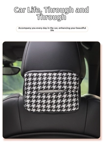 Detail of knitted houndstooth tissue holder with velcro strap hanging on car seat headrest