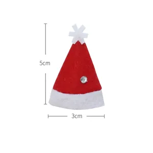 Mini red velvet Christmas hats for cutlery silverwares and festive party table decorations
