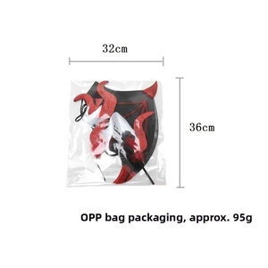 Detail of red and black glittery devil wing costume set with 32x36cm dimensions