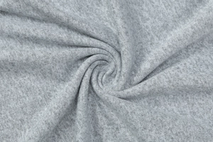Macro shot of soft heather grey knit fabric showing premium texture and drape