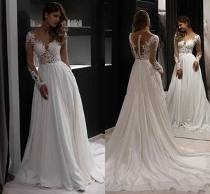 Detailed back view of long sleeve lace wedding dress with sheer embroidery and buttons