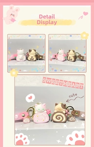 Close-up of pink and brown cat cake roll keychains with matching wrist straps