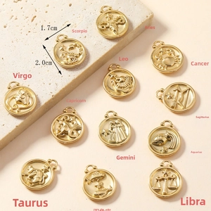 Macro shot of 18K gold-plated zodiac pendants with 1.7cm diameter and relief design
