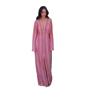 Detail of V-neck long sleeve maxi dress with geometric print and high side slit