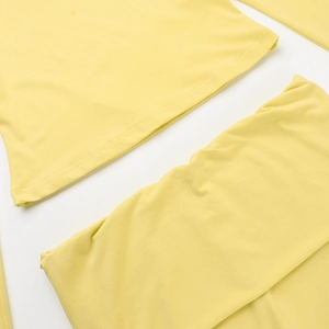Detailed macro view of yellow casual square neck set showing fabric texture and vibrant color