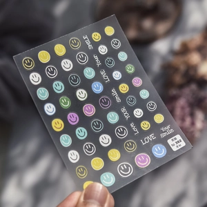 Colorful smile face embossed nail stickers with LOVE Your Smile text for DIY art