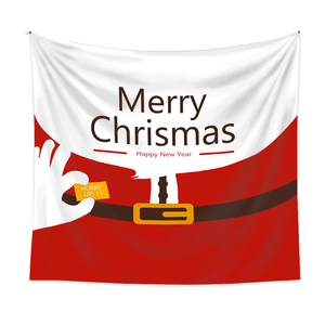 Macro shot of Christmas wall tapestry featuring Santa Claus outfit design and festive text