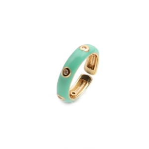 Adjustable gold ring with mint green enamel and inlaid diamonds in a minimalist style