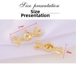 Detailed view of golden candy-shaped metal charms showing 21mm size and rhinestones
