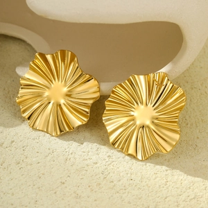 Elegant 18K gold-plated irregular sunburst stud earrings for women on stone background