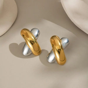 Two-tone 18K gold and silver twisted cross earrings in polished stainless steel