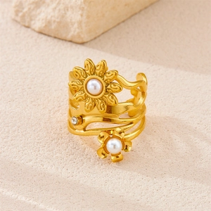 Macro detail of vintage 18k gold plated floral ring with pearls and zircon stone