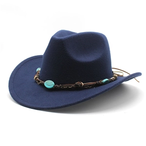 Detail of navy felt cowboy hat featuring turquoise stone and bohemian leather band