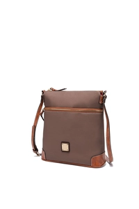 Detail of pebbled leather texture on crossbody bag with contrast corner reinforcement
