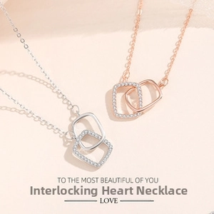 Detail of S925 silver Mobius double ring necklace with pave diamonds and smooth finish