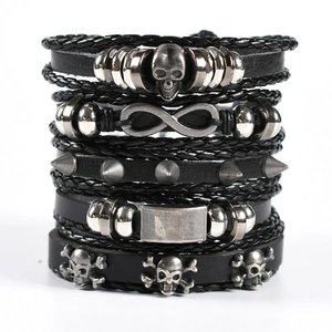 Men's multi-layer braided leather bracelet set with skull charms and metallic studs
