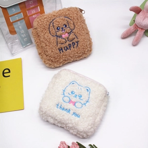 Close-up of plush teddy fleece sanitary pouches with cute cat and dog embroidery